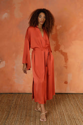 The Terracota Signature Mid-Length Robe is our modern and relaxed go-to for lounging around the house or layering over your look to head out the door and take on the day. Featuring subtly flared sleeves, to-the-knee side slits, and hidden on seam pockets (for all the important little things) you’ve just found the statement piece your wardrobe’s been missing.   All the pieces in our LOUNGE collection have been developed in a washable satin that feels like silk but can wash, wear, jet set, repeat.
