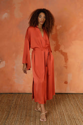 The Terracota Signature Mid-Length Robe is our modern and relaxed go-to for lounging around the house or layering over your look to head out the door and take on the day. Featuring subtly flared sleeves, to-the-knee side slits, and hidden on seam pockets (for all the important little things) you’ve just found the statement piece your wardrobe’s been missing.   All the pieces in our LOUNGE collection have been developed in a washable satin that feels like silk but can wash, wear, jet set, repeat.