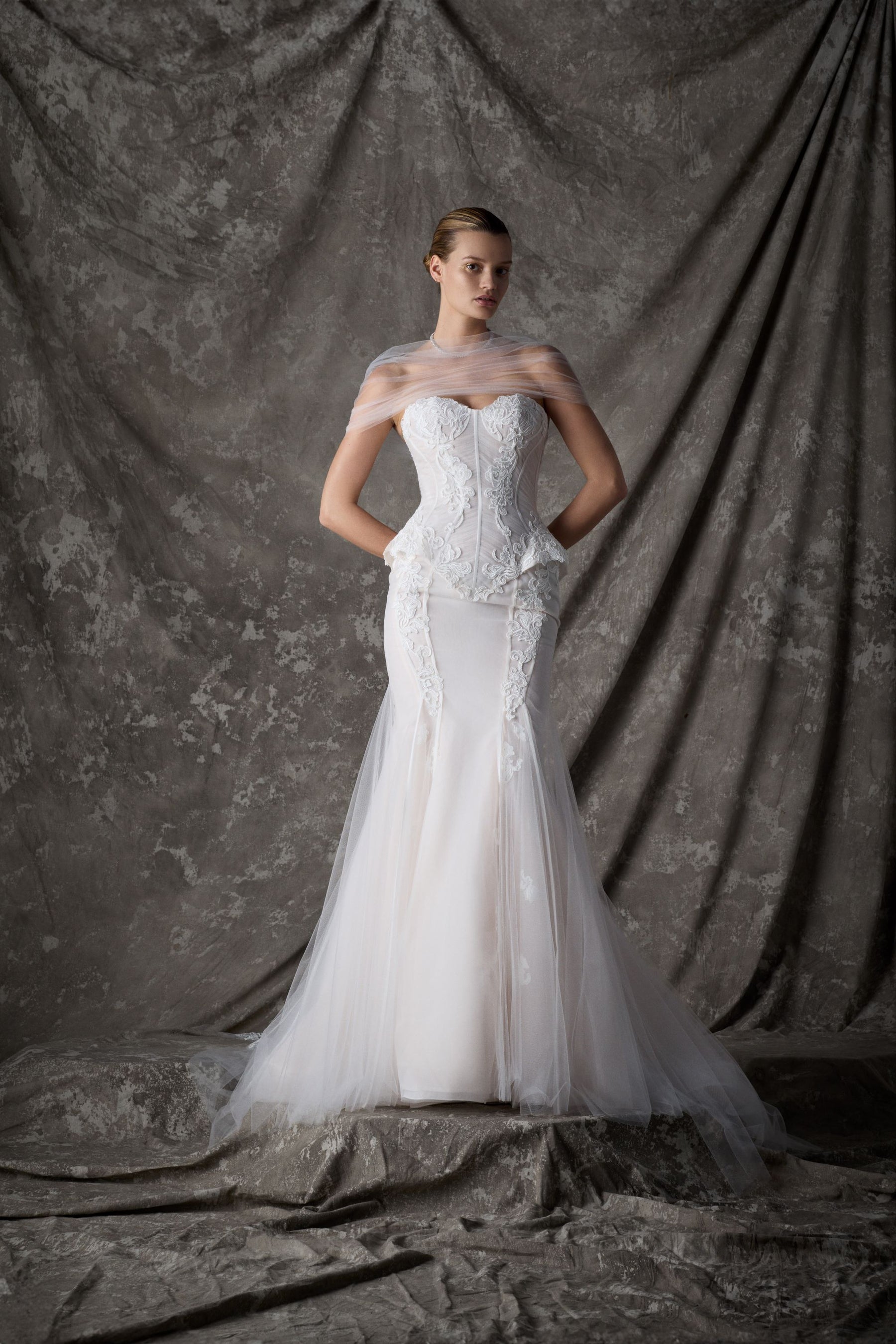 vespera corset dress Vespera is giving all the modern bridal energy. That hand-beaded bodice paired with a deep V neckline really makes a statement, and the illusion waistband pulls it all together. The chiffon skirt