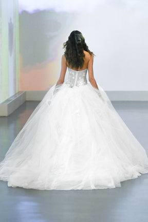 preen line esther dress A bespoke wedding gown for Alicia, featuring a graceful draped silhouette, crafted with a mix of two textured fabrics and adorned with delicate hand-beaded organza flowers